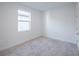 Bedroom features neutral carpet and natural light at 9199 Waverly Walk Dr, Orlando, FL 32817