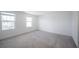 Bright bedroom featuring neutral carpet, and fresh white walls and trim at 9199 Waverly Walk Dr, Orlando, FL 32817