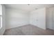Bright, carpeted bedroom with a connecting door at 9199 Waverly Walk Dr, Orlando, FL 32817