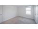 Bright bedroom with a window and carpeted floors, ideal for rest and relaxation at 9199 Waverly Walk Dr, Orlando, FL 32817
