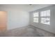 Bright, carpeted bedroom with two large windows offering plenty of natural light at 9199 Waverly Walk Dr, Orlando, FL 32817