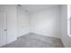 Bedroom featuring neutral carpet, fresh, white walls, and multiple doors leading to other rooms at 9199 Waverly Walk Dr, Orlando, FL 32817