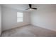 Bedroom with neutral carpet, a ceiling fan, and a window providing natural light at 9199 Waverly Walk Dr, Orlando, FL 32817