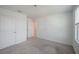 Bright, carpeted bedroom with a connecting door at 9199 Waverly Walk Dr, Orlando, FL 32817