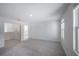 Large bright bedroom with neutral carpet and two windows for natural light at 9199 Waverly Walk Dr, Orlando, FL 32817