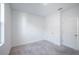 Cozy bedroom featuring neutral carpet, fresh, white walls, and two doors leading to other rooms at 9199 Waverly Walk Dr, Orlando, FL 32817