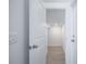 Hallway view looking into a room, featuring neutral paint and tile flooring at 9199 Waverly Walk Dr, Orlando, FL 32817