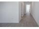 Bright hallway featuring modern wood-look flooring leading to other rooms in the house at 9199 Waverly Walk Dr, Orlando, FL 32817