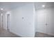 Hallway view on second floor shows neutral paint and carpet at 9199 Waverly Walk Dr, Orlando, FL 32817