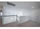 Second floor landing with neutral carpet and white walls with stairs at 9199 Waverly Walk Dr, Orlando, FL 32817
