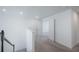 Neutral carpet on a second floor landing leading to other rooms at 9199 Waverly Walk Dr, Orlando, FL 32817