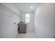 Cozy laundry room featuring a washing machine and practical shelving at 9199 Waverly Walk Dr, Orlando, FL 32817