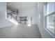 Living room features many windows, tile floors, and open floor plan leading to the modern kitchen at 9199 Waverly Walk Dr, Orlando, FL 32817