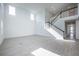 Bright living room with tile floors and black and white staircase at 9199 Waverly Walk Dr, Orlando, FL 32817