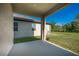Outdoor covered patio with view of the home's lawn at 9199 Waverly Walk Dr, Orlando, FL 32817