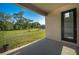 Covered patio with view of pond and green lawn at 9199 Waverly Walk Dr, Orlando, FL 32817