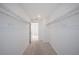 Walk-in closet with carpet and metal shelving, illuminated by a window for natural light at 9199 Waverly Walk Dr, Orlando, FL 32817