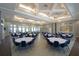 Elegant ballroom featuring chandeliers, tables, and chairs, perfect for community events and gatherings at 9422 Jaywood Rd, Winter Garden, FL 34787