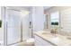 Modern bathroom with a granite vanity and glass enclosed shower at 9422 Jaywood Rd, Winter Garden, FL 34787