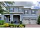 Attractive two-story home showcasing a covered porch, manicured landscaping, and a double garage at 9422 Jaywood Rd, Winter Garden, FL 34787