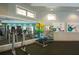 Spacious gym with fitness equipment, mirror, and storage for exercise balls and equipment at 9422 Jaywood Rd, Winter Garden, FL 34787