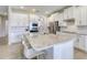 Bright kitchen featuring a large island with seating, granite countertops and stainless steel appliances at 9422 Jaywood Rd, Winter Garden, FL 34787