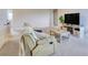 Upstairs living room with a TV and comfortable seating, perfect for relaxing and enjoying entertainment at 9422 Jaywood Rd, Winter Garden, FL 34787