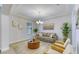 Bright living room with neutral decor, stylish furnishings, and a large window providing natural light at 9422 Jaywood Rd, Winter Garden, FL 34787