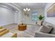 Bright living room features a neutral color scheme, recessed lighting, and front door view at 9422 Jaywood Rd, Winter Garden, FL 34787