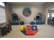 A colorful playroom offers submarine-themed seating, a play area, and natural light from a window at 9422 Jaywood Rd, Winter Garden, FL 34787