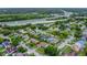 Aerial view of a peaceful residential neighborhood with lush greenery at 9833 Tattersall Ave, Orlando, FL 32817