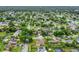 Aerial shot capturing the serene neighborhood, framed by lush trees at 9833 Tattersall Ave, Orlando, FL 32817