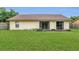 Large, flat back yard with two sliding glass doors, perfect for entertaining at 9833 Tattersall Ave, Orlando, FL 32817