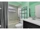 This bathroom features a shower/tub combo, a toilet, and a vanity with countertop space at 9833 Tattersall Ave, Orlando, FL 32817