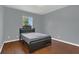 This bedroom has laminate flooring and a window which allows for natural light at 9833 Tattersall Ave, Orlando, FL 32817
