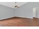 Bright, cozy room featuring hardwood flooring and neutral walls at 9833 Tattersall Ave, Orlando, FL 32817