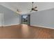 Spacious living room with hardwood flooring and sliding glass doors to the backyard at 9833 Tattersall Ave, Orlando, FL 32817