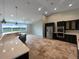 Spacious kitchen with stainless steel appliances, travertine floors, and a large window view at 10170 Se 106Th Ln, Belleview, FL 34420