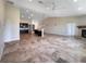 Bright, open living space with tile floors, recessed lighting, and views into the kitchen and dining area at 10170 Se 106Th Ln, Belleview, FL 34420