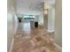 Open-concept living area with tile flooring, a fireplace, and views of the kitchen island and outdoor scenery at 10170 Se 106Th Ln, Belleview, FL 34420