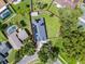 Aerial view of the property with the property line outlined and showing nearby homes and landscaping at 1020 Taproot Dr, Winter Springs, FL 32708