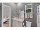 Bathroom featuring a sink, vanity and window at 1020 Taproot Dr, Winter Springs, FL 32708