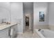 Bathroom featuring a soaking tub, walk-in closet, and a shower enclosure at 1020 Taproot Dr, Winter Springs, FL 32708