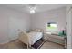 Comfortable bedroom with a bed, desk, and ample natural light at 1020 Taproot Dr, Winter Springs, FL 32708