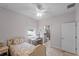 Bright bedroom with a bed, desk, and an ensuite bathroom at 1020 Taproot Dr, Winter Springs, FL 32708