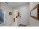 Bright foyer featuring tile floors, coat hooks and a view into the living spaces beyond at 1020 Taproot Dr, Winter Springs, FL 32708
