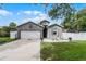 Charming gray single-Gathering home with a two-car garage and quaint front patio at 1020 Taproot Dr, Winter Springs, FL 32708