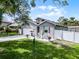 Charming home with a well-manicured lawn, a driveway, and a quaint outdoor seating area at 1020 Taproot Dr, Winter Springs, FL 32708