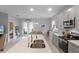 Bright kitchen with a large island, stainless appliances, and access to the outdoor area at 1020 Taproot Dr, Winter Springs, FL 32708