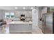Modern kitchen with gray cabinets, stainless steel appliances, and a spacious center island at 1020 Taproot Dr, Winter Springs, FL 32708